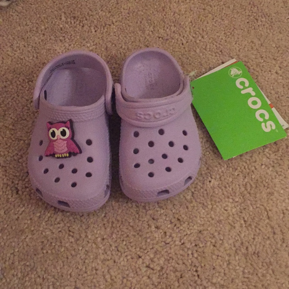Brand new Crocs with charm!